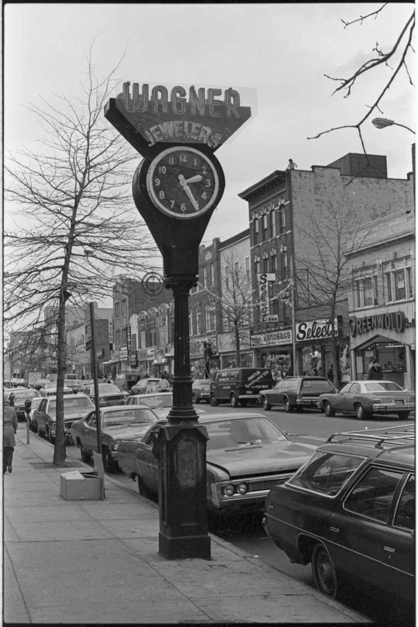 Black and white image of a street clock with the words "Wagner Jewelers" on top