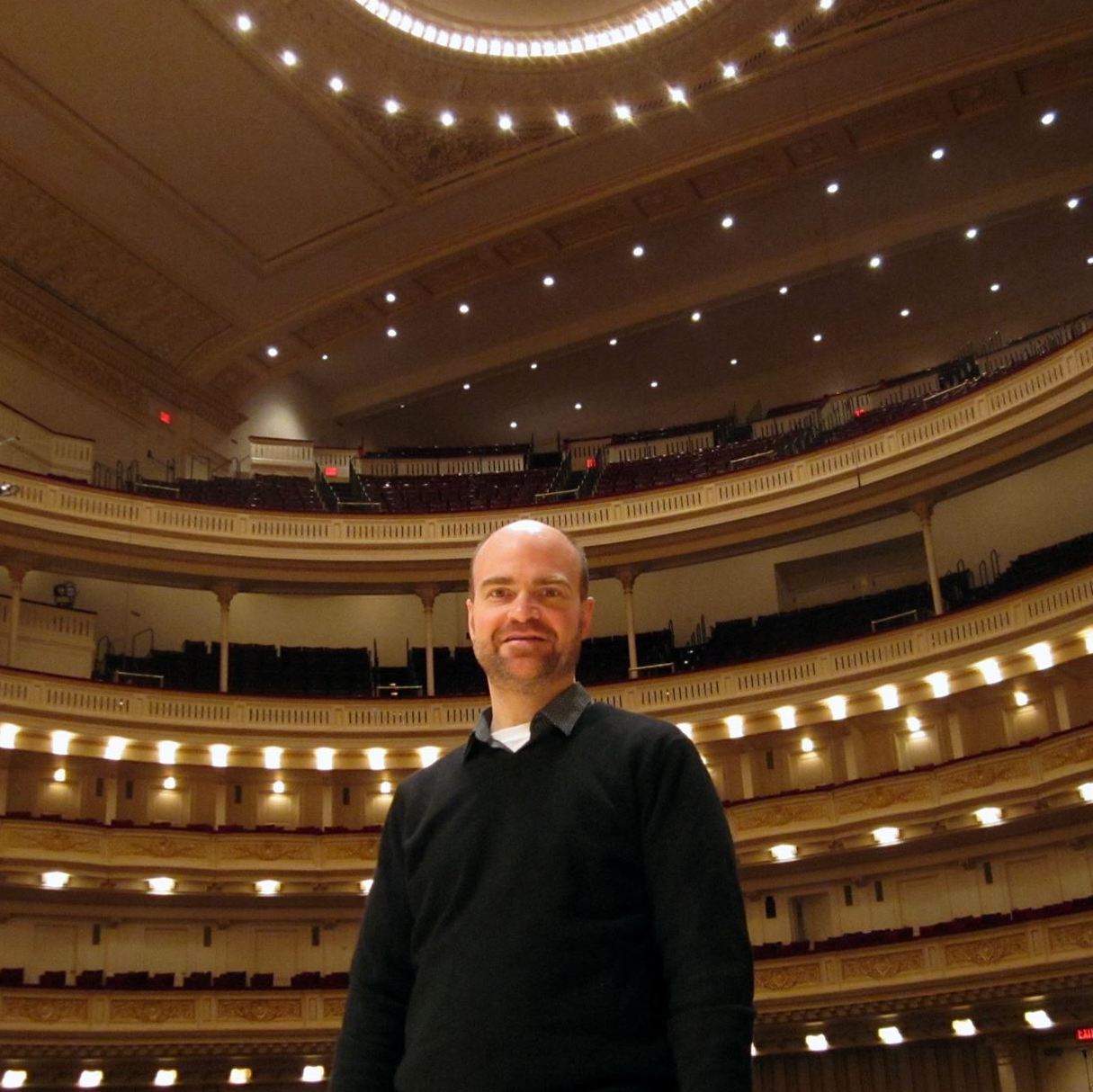 Rob Hudson standing in a concert hall